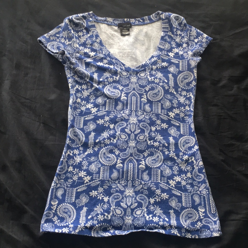 blue, tighter fitting shirt with floral design